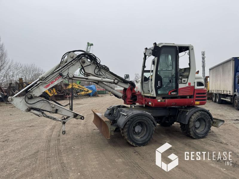 Takeuchi TB295W - Riteņu ekskavators: foto 1 Takeuchi TB295W - Riteņu ekskavators: foto 1