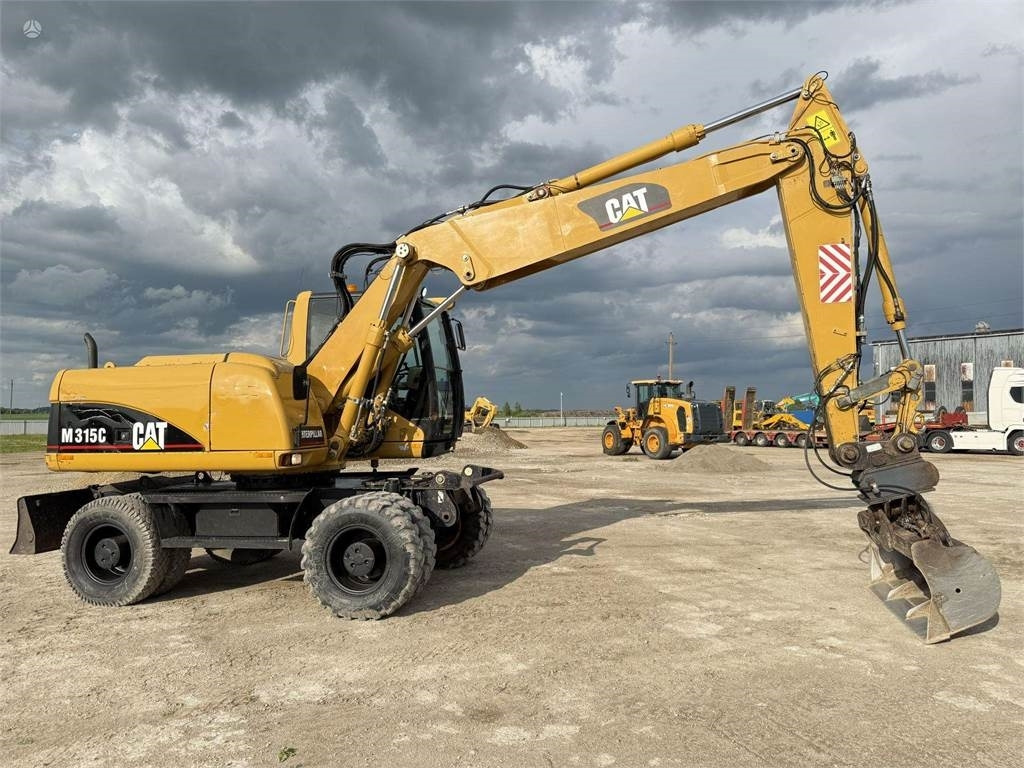 Riteņu ekskavators CAT M315C: foto 8