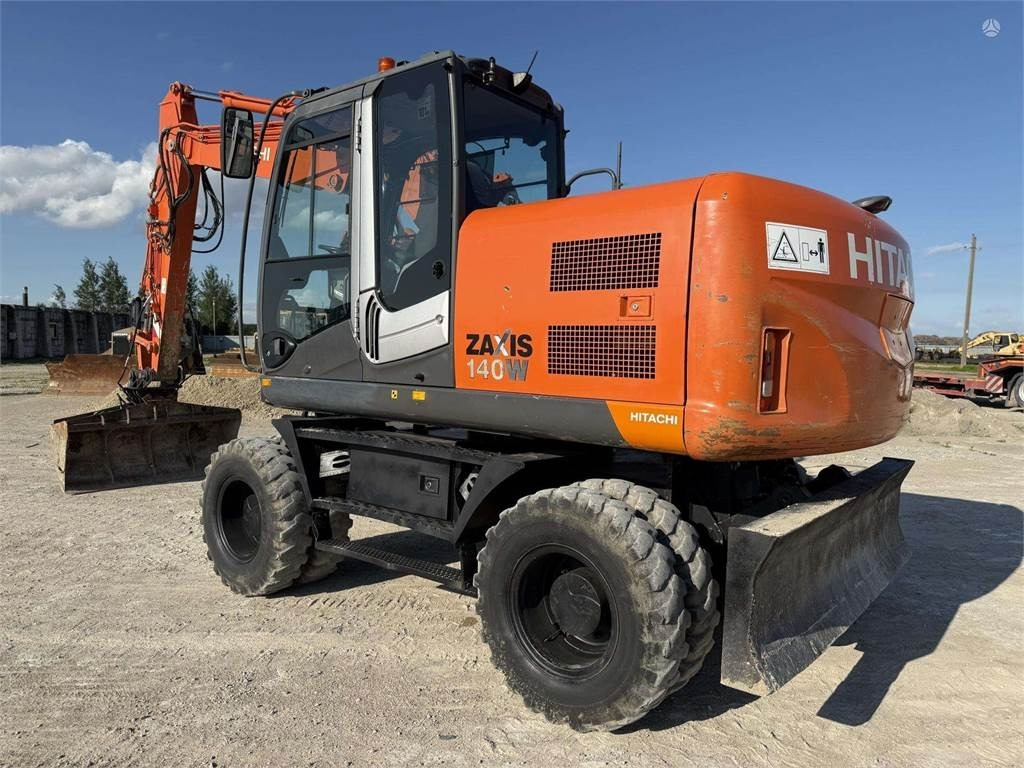 Hitachi ZX 140 W - Riteņu ekskavators: foto 1 Hitachi ZX 140 W - Riteņu ekskavators: foto 1