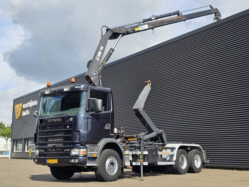 Scania R114.340 6x2 / HIAB CRANE + 25T HOOKLIFT - Pacēlājs ar āķi, Kravas auto ar manipulatoru: foto 1 Scania R114.340 6x2 / HIAB CRANE + 25T HOOKLIFT - Pacēlājs ar āķi, Kravas auto ar manipulatoru: foto 1