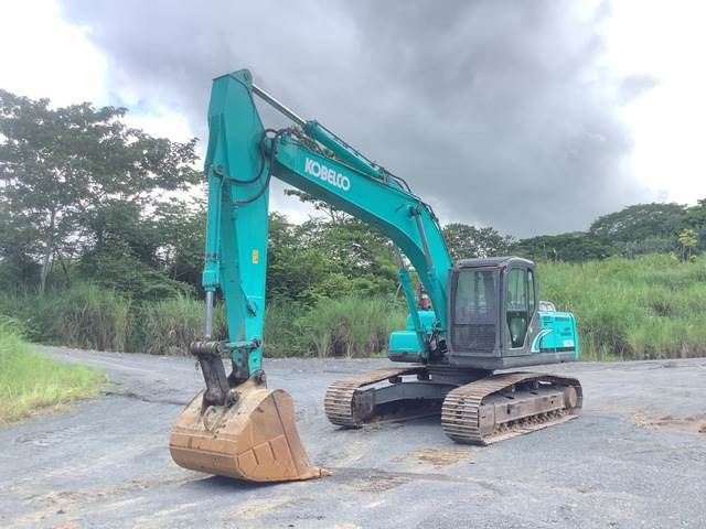 Kobelco SK210LC - Kāpurķēžu ekskavators: foto 1 Kobelco SK210LC - Kāpurķēžu ekskavators: foto 1