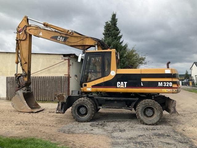 CAT M320 - Riteņu ekskavators: foto 1 CAT M320 - Riteņu ekskavators: foto 1