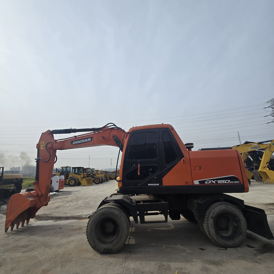DOOSAN DX150W - Riteņu ekskavators: foto 2 DOOSAN DX150W - Riteņu ekskavators: foto 2