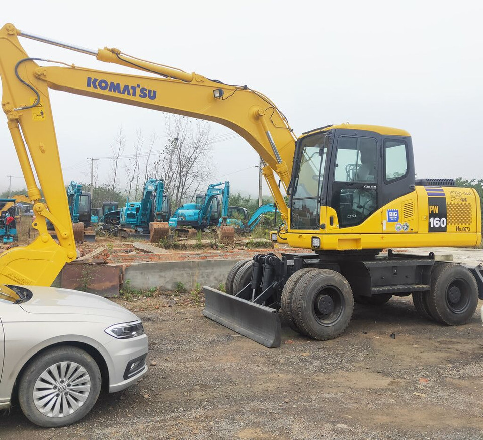 Komatsu PW160 - Riteņu ekskavators: foto 1 Komatsu PW160 - Riteņu ekskavators: foto 1