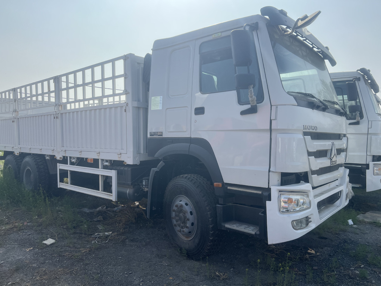 SINOTRUK HOWO FENCE LIVESTOCK TRUCK - Kravas automašīna pašizgāzējs: foto 1 SINOTRUK HOWO FENCE LIVESTOCK TRUCK - Kravas automašīna pašizgāzējs: foto 1