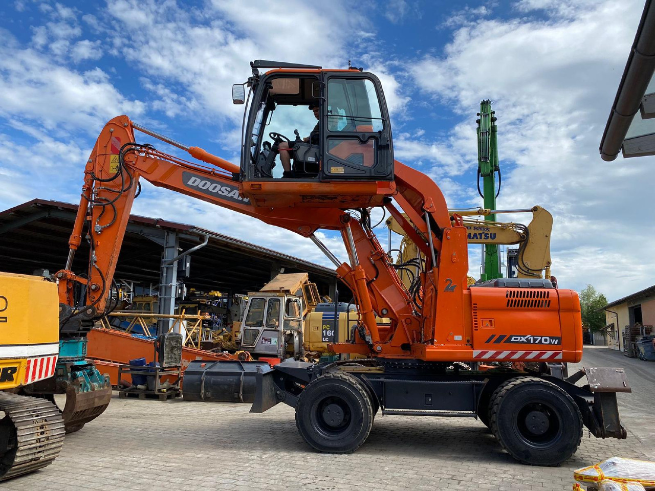 Doosan DX 170 W - Riteņu ekskavators: foto 1 Doosan DX 170 W - Riteņu ekskavators: foto 1