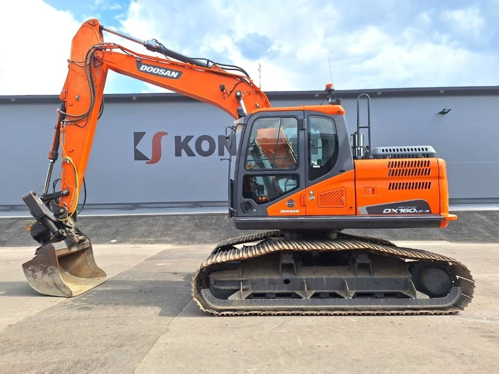Doosan DX160LCH-5 METSÄMALLI KALLISTAJALLA - Kāpurķēžu ekskavators: foto 1 Doosan DX160LCH-5 METSÄMALLI KALLISTAJALLA - Kāpurķēžu ekskavators: foto 1