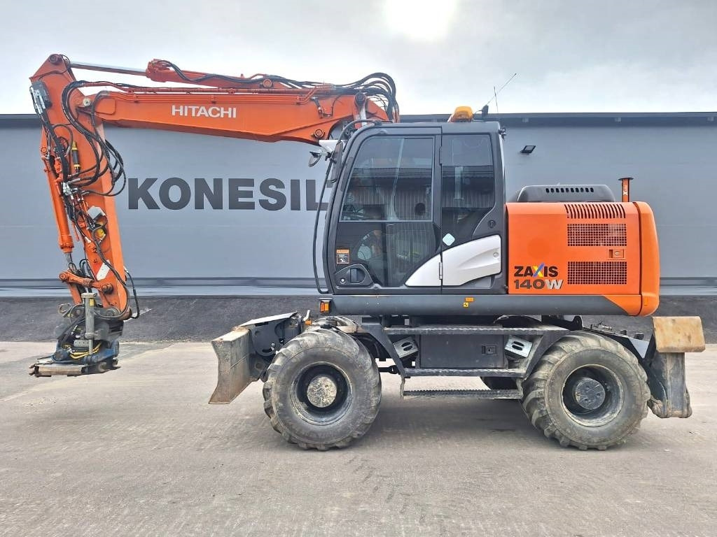 Hitachi ZX140W-5 HUIPPUVARUSTEET - Riteņu ekskavators: foto 1 Hitachi ZX140W-5 HUIPPUVARUSTEET - Riteņu ekskavators: foto 1