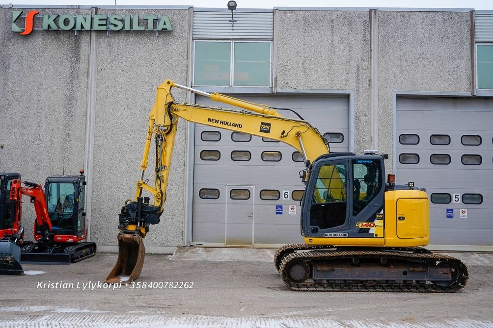 New Holland E140CSR PYÖRITTÄJÄLLÄ - Kāpurķēžu ekskavators: foto 1 New Holland E140CSR PYÖRITTÄJÄLLÄ - Kāpurķēžu ekskavators: foto 1