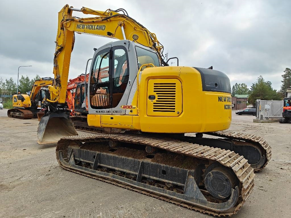 New Holland E200SRLC KALLISTUVA KAUHA - Kāpurķēžu ekskavators: foto 2 New Holland E200SRLC KALLISTUVA KAUHA - Kāpurķēžu ekskavators: foto 2