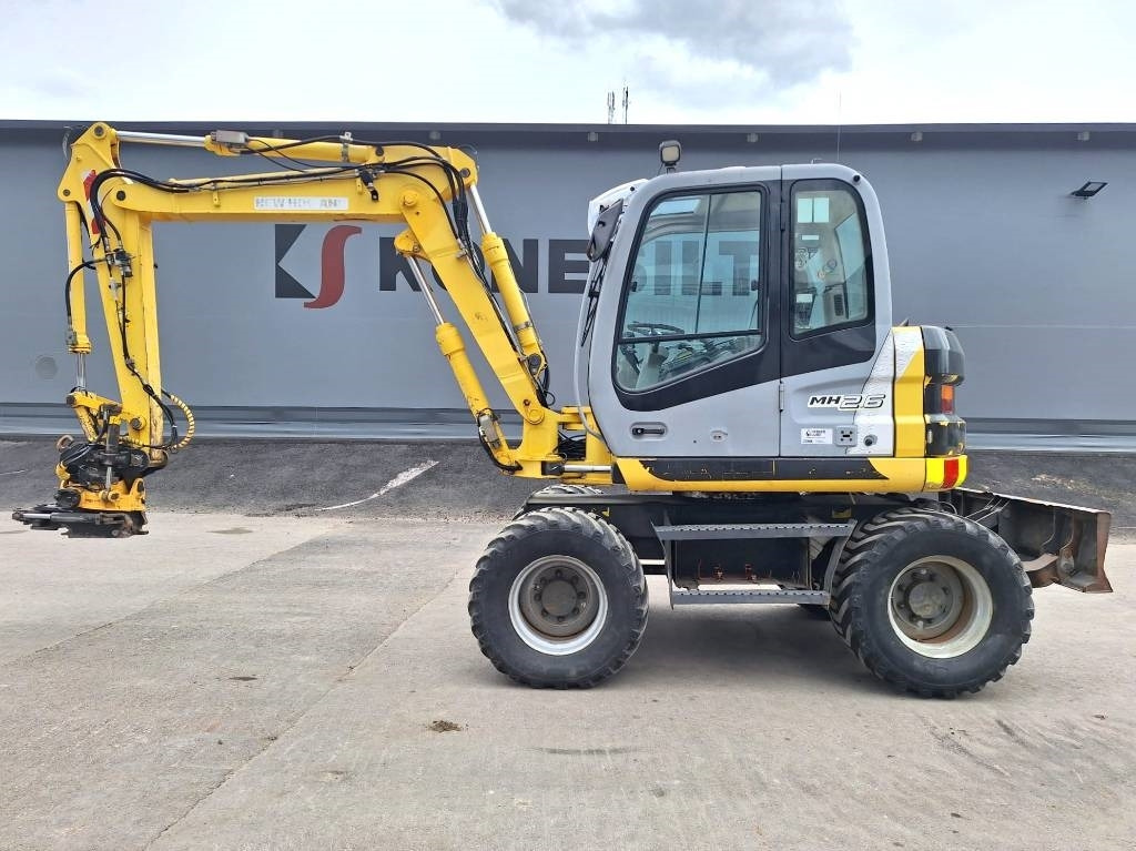 New Holland MH2.6 ENGCON PIHDEILLÄ - Riteņu ekskavators: foto 1 New Holland MH2.6 ENGCON PIHDEILLÄ - Riteņu ekskavators: foto 1