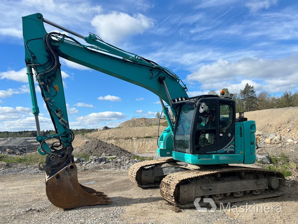 Grävmaskin Kobelco SK230SRLC-5E med tiltrotator & skopor - Kāpurķēžu ekskavators: foto 1 Grävmaskin Kobelco SK230SRLC-5E med tiltrotator & skopor - Kāpurķēžu ekskavators: foto 1