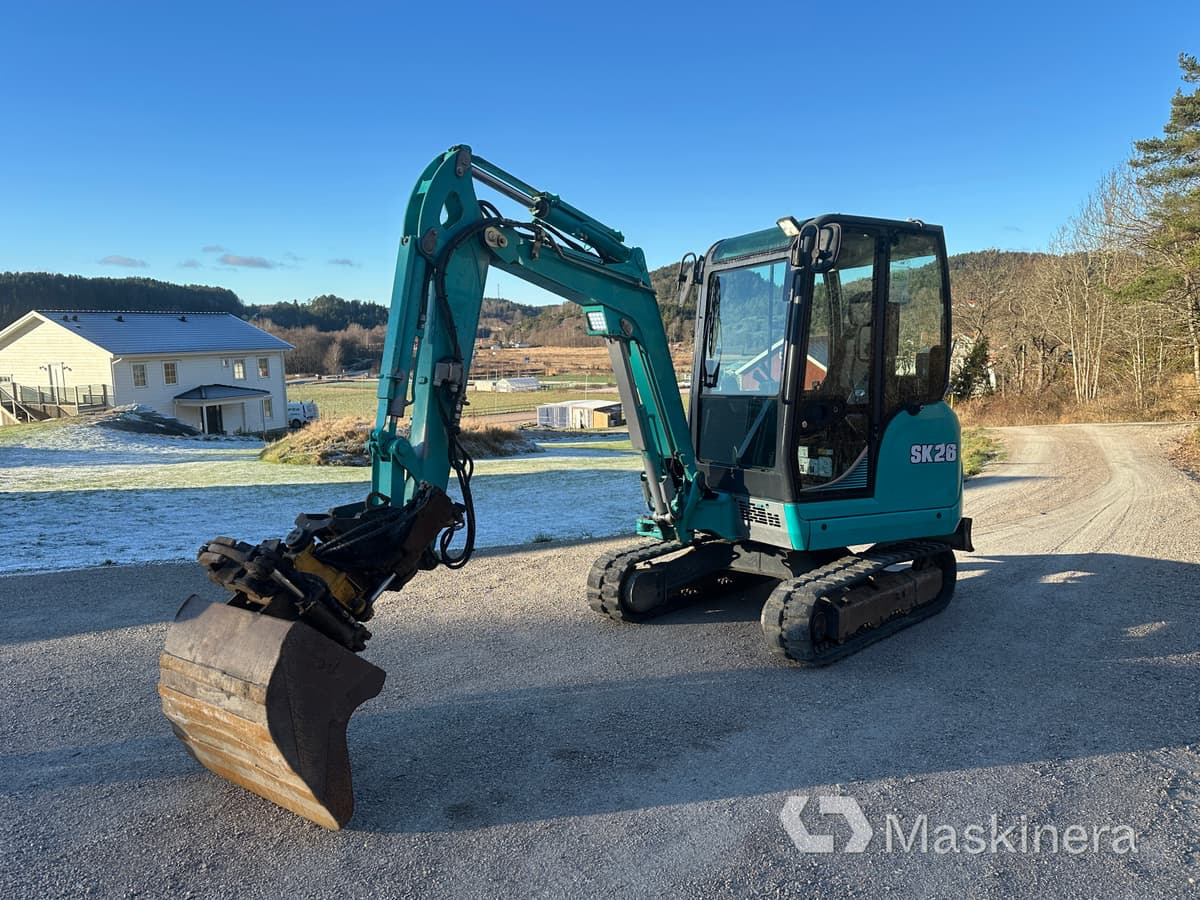 Grävmaskin Kobelco SK26 - Kāpurķēžu ekskavators: foto 1 Grävmaskin Kobelco SK26 - Kāpurķēžu ekskavators: foto 1