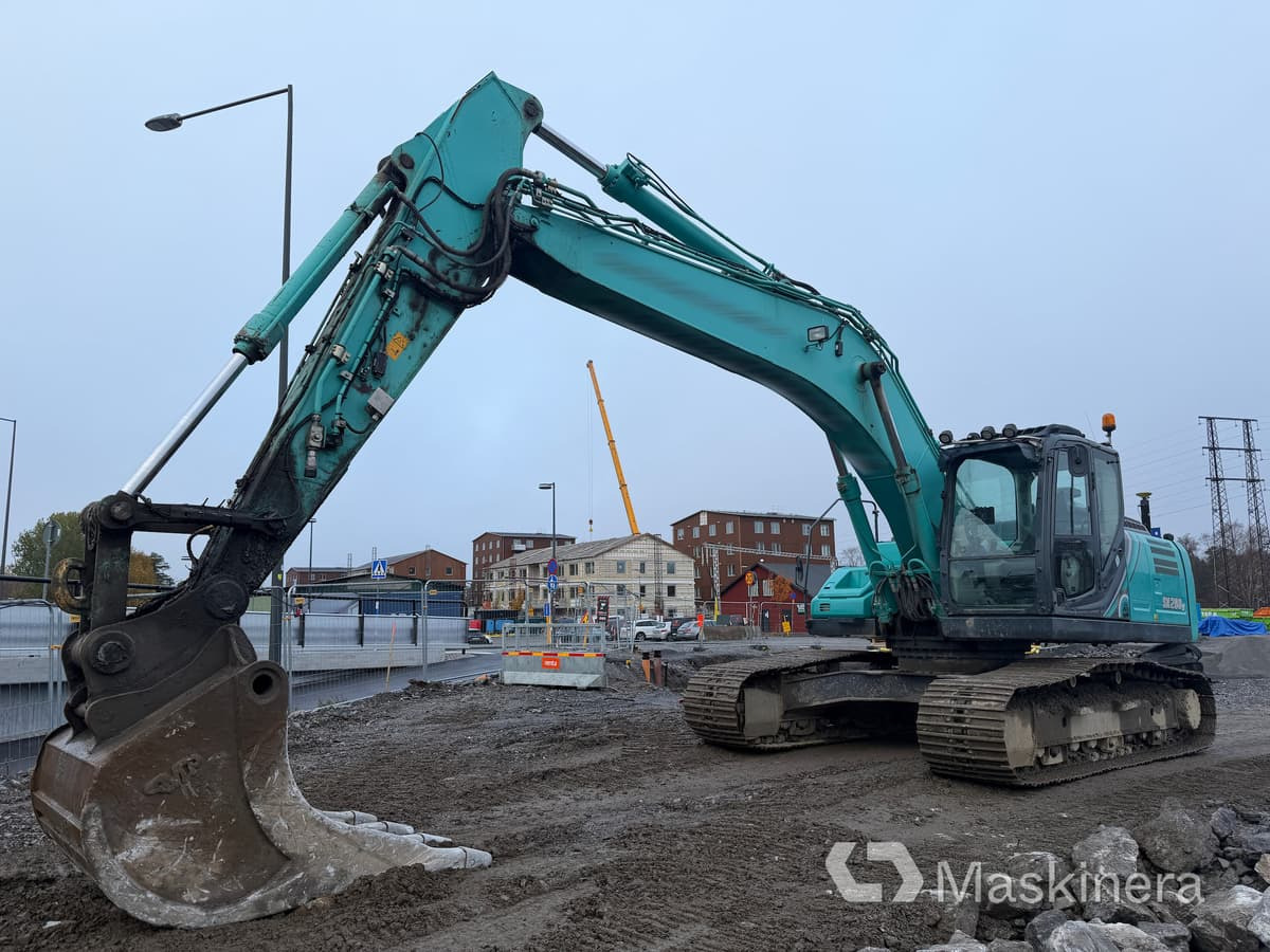 Grävmaskin Kobelco SK260LC-10 - Kāpurķēžu ekskavators: foto 1 Grävmaskin Kobelco SK260LC-10 - Kāpurķēžu ekskavators: foto 1