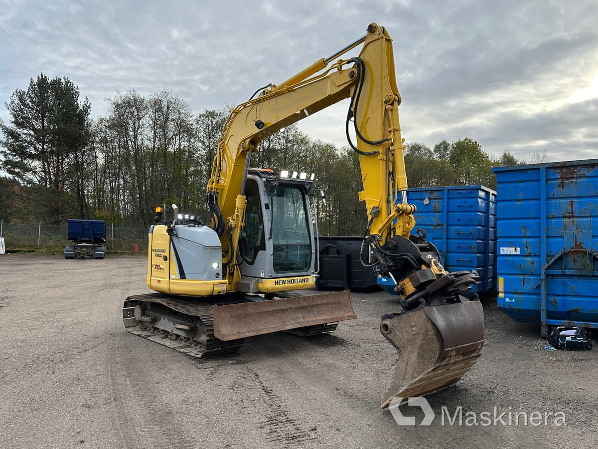 Grävmaskin New Holland Kobelco E70BSR-2 - Kāpurķēžu ekskavators: foto 1 Grävmaskin New Holland Kobelco E70BSR-2 - Kāpurķēžu ekskavators: foto 1