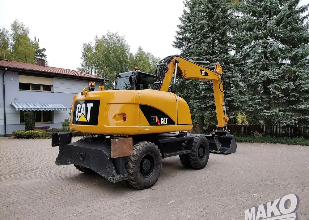 Caterpillar M313D - Riteņu ekskavators: foto 4 Caterpillar M313D - Riteņu ekskavators: foto 4