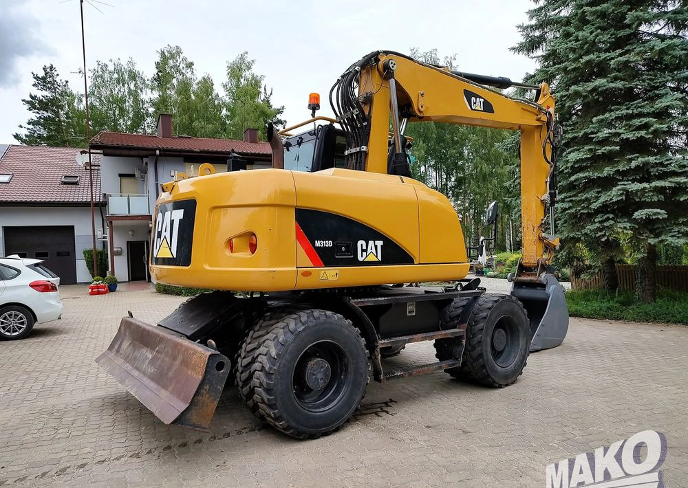 Caterpillar M313D - Riteņu ekskavators: foto 4 Caterpillar M313D - Riteņu ekskavators: foto 4