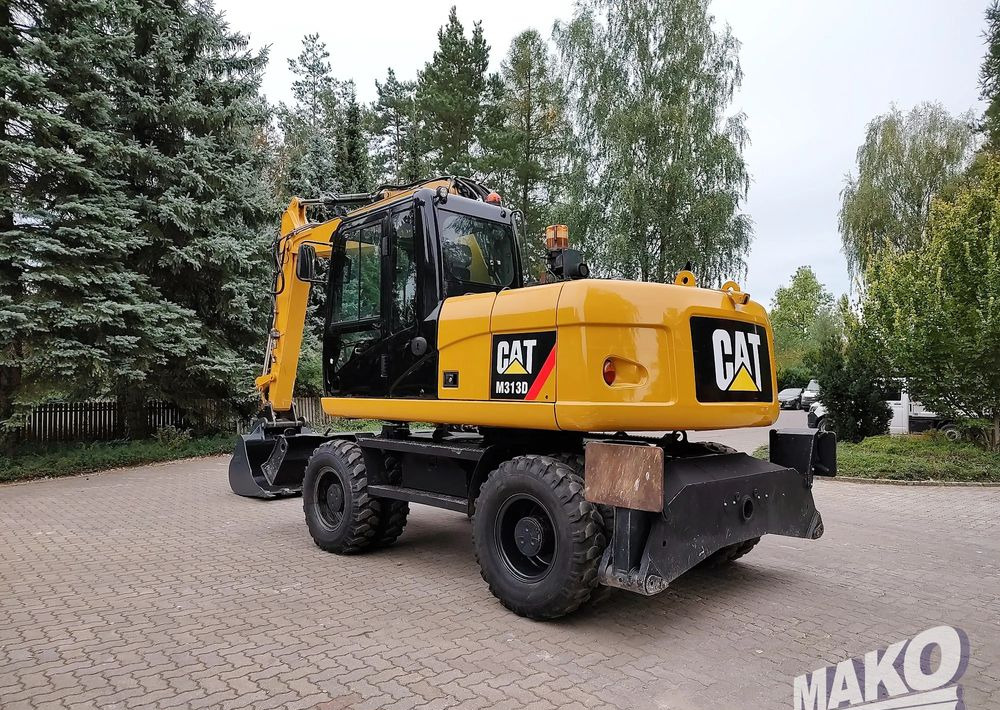 Caterpillar M313D - Riteņu ekskavators: foto 2 Caterpillar M313D - Riteņu ekskavators: foto 2
