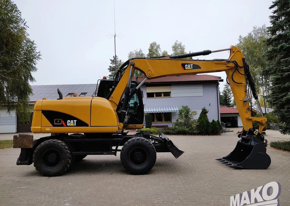 Caterpillar M313D - Riteņu ekskavators: foto 5 Caterpillar M313D - Riteņu ekskavators: foto 5