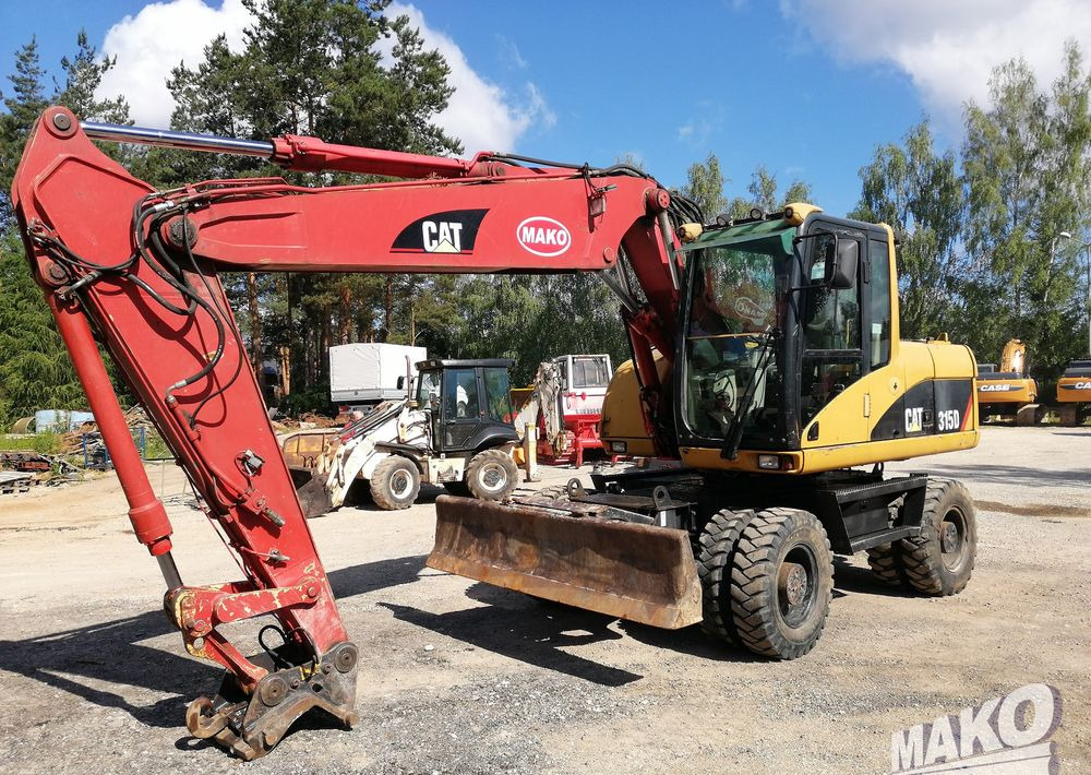 Caterpillar M315 C - Riteņu ekskavators: foto 1 Caterpillar M315 C - Riteņu ekskavators: foto 1