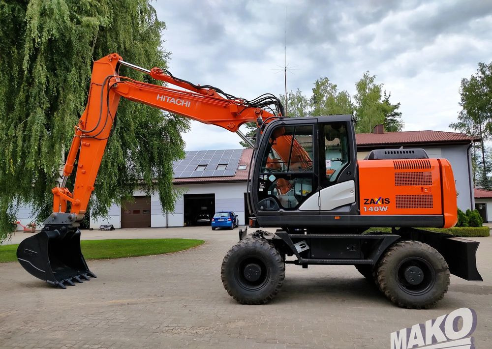 Hitachi ZX 140 - Riteņu ekskavators: foto 1 Hitachi ZX 140 - Riteņu ekskavators: foto 1