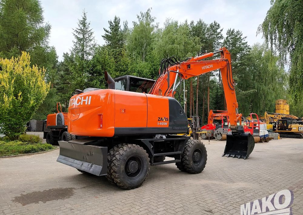 Hitachi ZX 140 - Riteņu ekskavators: foto 4 Hitachi ZX 140 - Riteņu ekskavators: foto 4