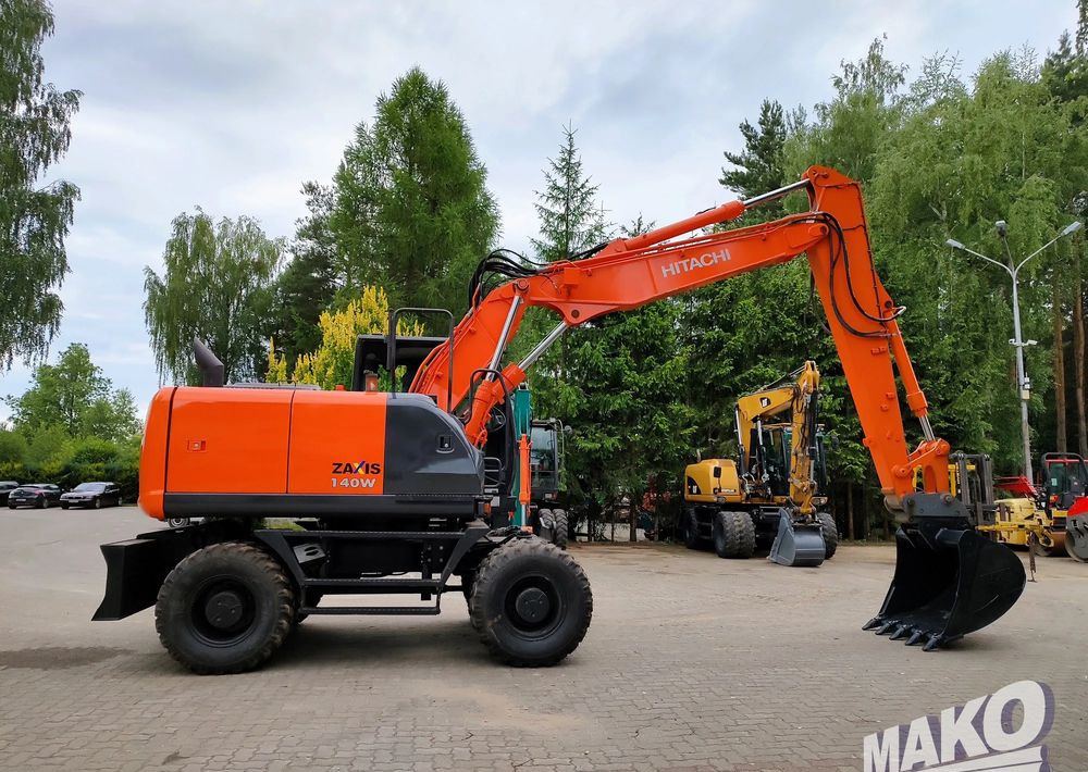 Hitachi ZX 140 - Riteņu ekskavators: foto 5 Hitachi ZX 140 - Riteņu ekskavators: foto 5