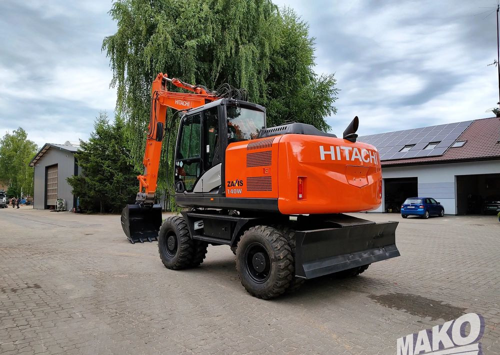 Hitachi ZX 140 - Riteņu ekskavators: foto 2 Hitachi ZX 140 - Riteņu ekskavators: foto 2