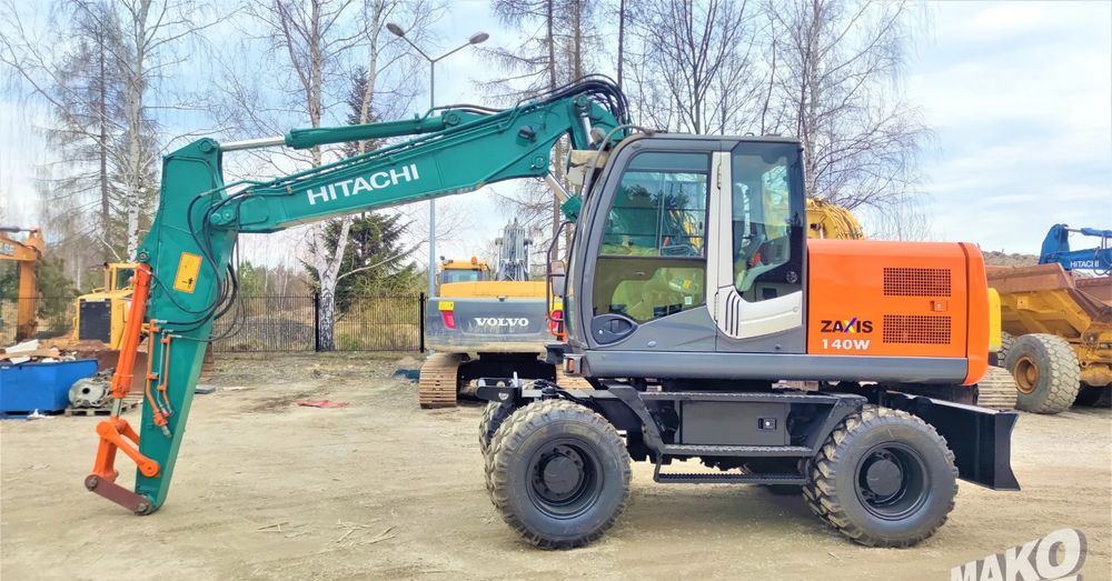 Hitachi ZX140W-3 - Riteņu ekskavators: foto 1 Hitachi ZX140W-3 - Riteņu ekskavators: foto 1