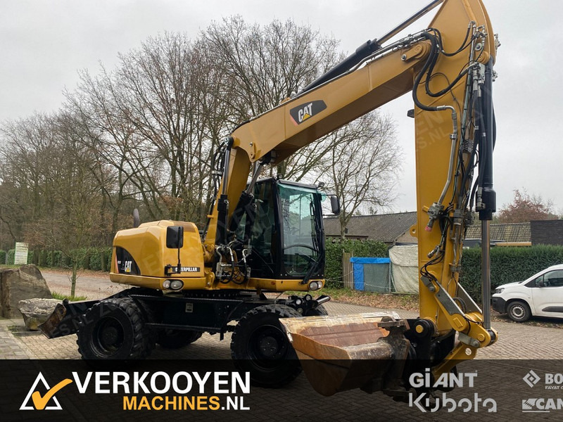 Caterpillar M313D - Riteņu ekskavators: foto 2 Caterpillar M313D - Riteņu ekskavators: foto 2