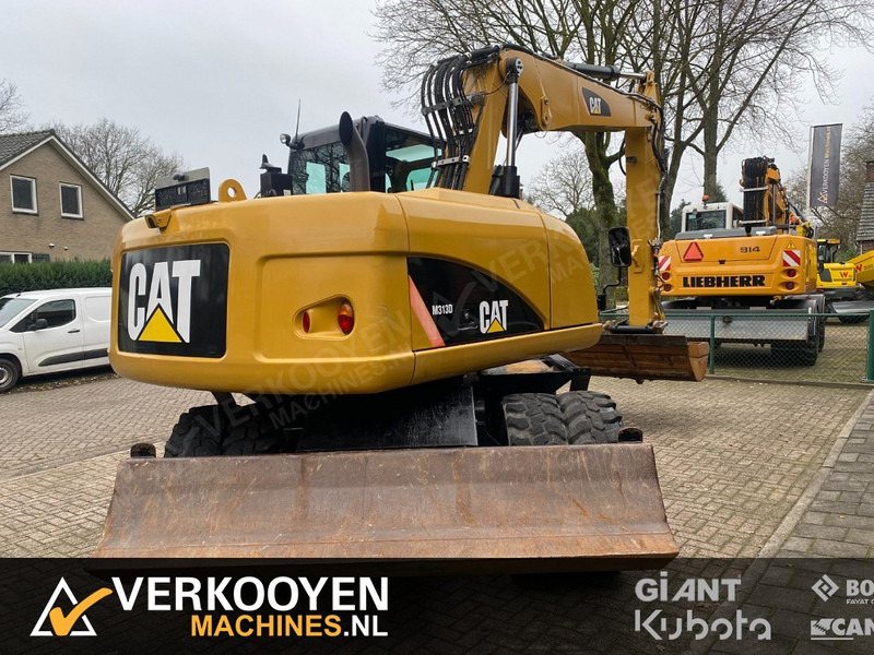 Caterpillar M313D - Riteņu ekskavators: foto 3 Caterpillar M313D - Riteņu ekskavators: foto 3