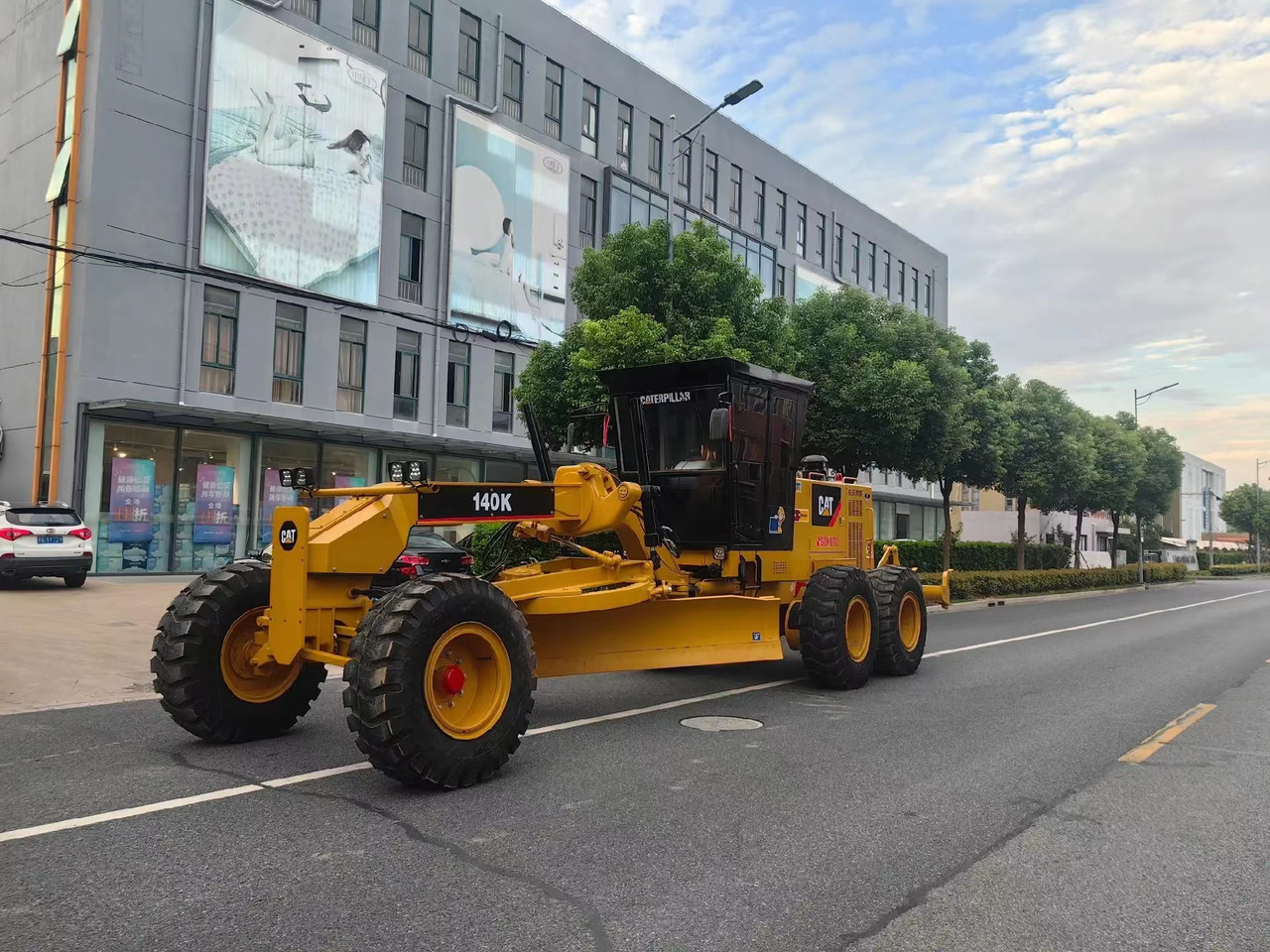 Caterpillar 140K Motor Grader Road Construction Machine - Greiders: foto 1 Caterpillar 140K Motor Grader Road Construction Machine - Greiders: foto 1