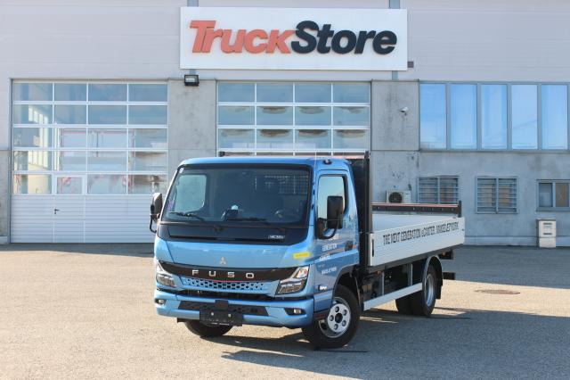 FUSO Canter 4C15E M - BATT. - Automašīna ar kravas platformu: foto 1 FUSO Canter 4C15E M - BATT. - Automašīna ar kravas platformu: foto 1