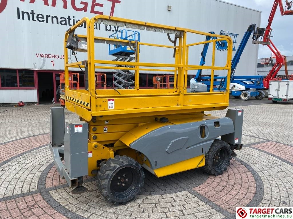 Haulotte Compact 10DX Diesel 4x4 Scissor Work Lift 1015cm - Šķērveida pacēlājs: foto 1 Haulotte Compact 10DX Diesel 4x4 Scissor Work Lift 1015cm - Šķērveida pacēlājs: foto 1