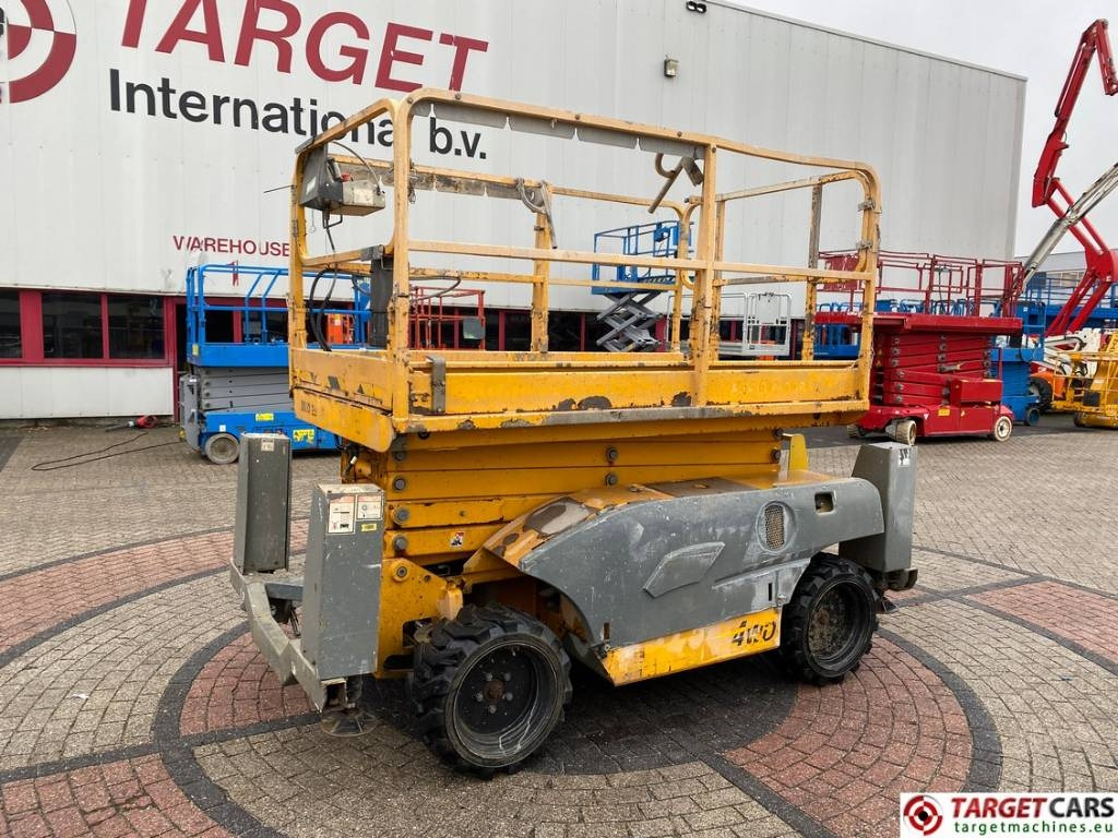 Haulotte Compact 12DX Diesel 4x4 Scissor Work Lift 1206cm - Šķērveida pacēlājs: foto 1 Haulotte Compact 12DX Diesel 4x4 Scissor Work Lift 1206cm - Šķērveida pacēlājs: foto 1