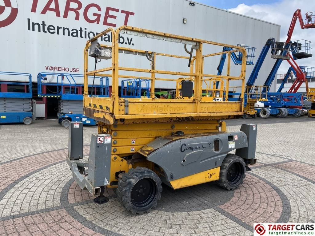 Haulotte Compact 12DX Diesel 4x4 Scissor Work Lift 1206cm - Šķērveida pacēlājs: foto 1 Haulotte Compact 12DX Diesel 4x4 Scissor Work Lift 1206cm - Šķērveida pacēlājs: foto 1