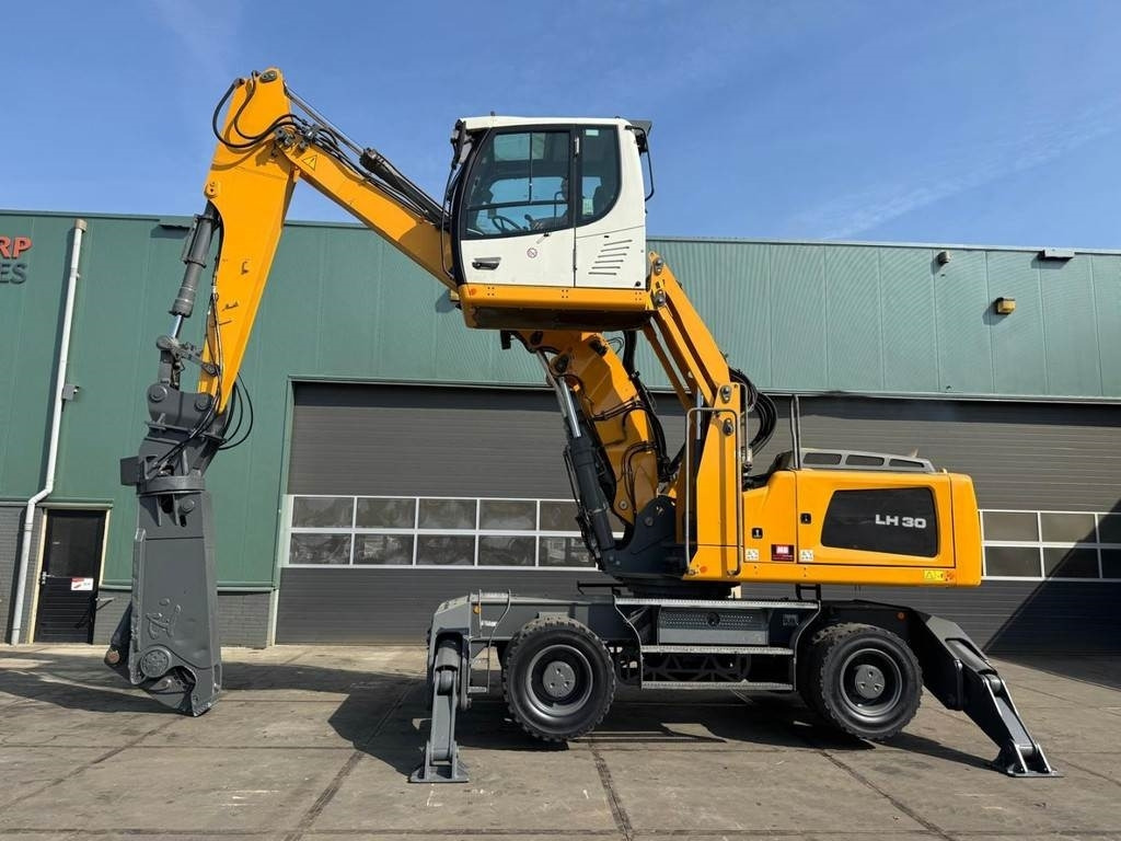 Liebherr LH 30 M - Atkritumu iekrāvējs: foto 1 Liebherr LH 30 M - Atkritumu iekrāvējs: foto 1