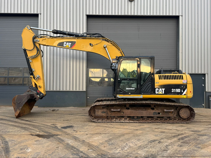 Caterpillar 319DL - Kāpurķēžu ekskavators: foto 1 Caterpillar 319DL - Kāpurķēžu ekskavators: foto 1