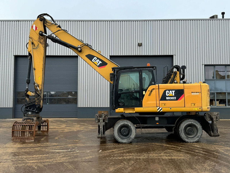 Caterpillar MH3022 - Atkritumu iekrāvējs: foto 1 Caterpillar MH3022 - Atkritumu iekrāvējs: foto 1