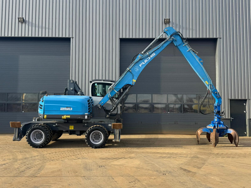 Atkritumu iekrāvējs Fuchs MHL 250: foto 9 Atkritumu iekrāvējs Fuchs MHL 250: foto 9