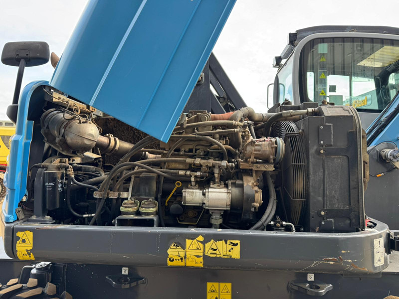 Atkritumu iekrāvējs Fuchs MHL 250: foto 18 Atkritumu iekrāvējs Fuchs MHL 250: foto 18