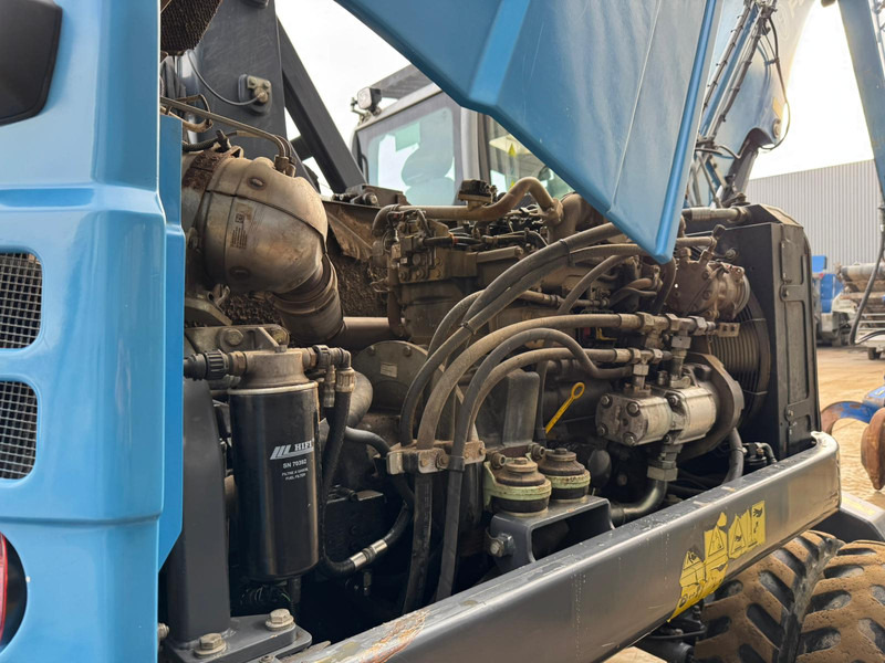 Atkritumu iekrāvējs Fuchs MHL 250: foto 20 Atkritumu iekrāvējs Fuchs MHL 250: foto 20