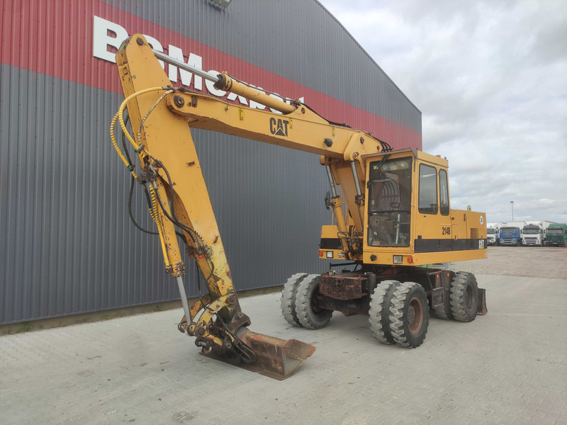 Caterpillar 214 B wheel excavator - Riteņu ekskavators: foto 2 Caterpillar 214 B wheel excavator - Riteņu ekskavators: foto 2