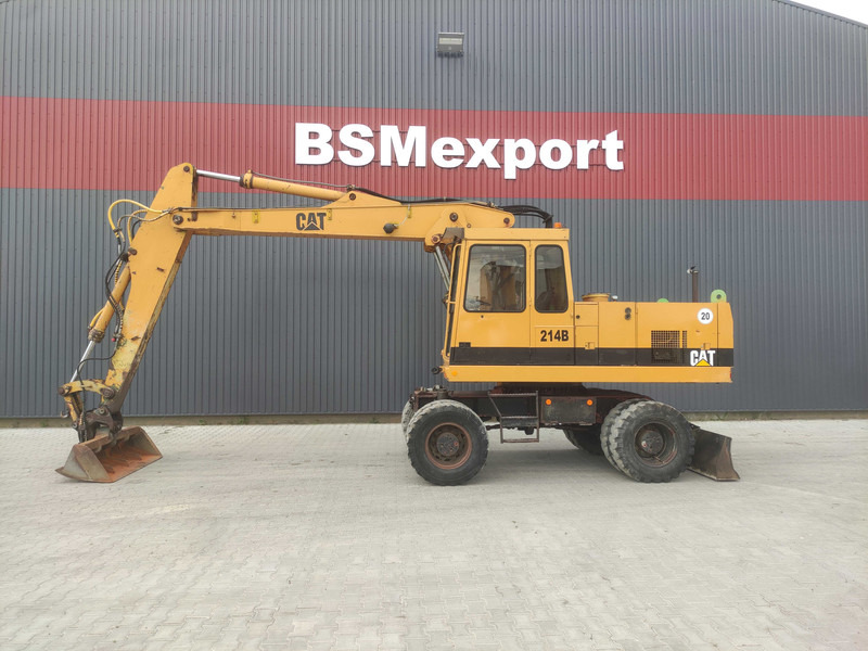 Caterpillar 214 B wheel excavator - Riteņu ekskavators: foto 1 Caterpillar 214 B wheel excavator - Riteņu ekskavators: foto 1