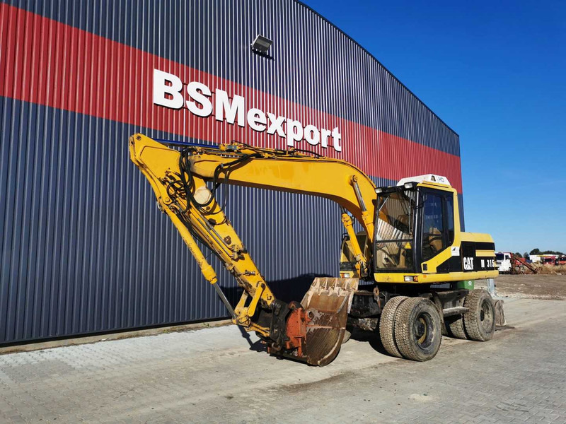 Caterpillar M315 wheel excavator - Riteņu ekskavators: foto 2 Caterpillar M315 wheel excavator - Riteņu ekskavators: foto 2