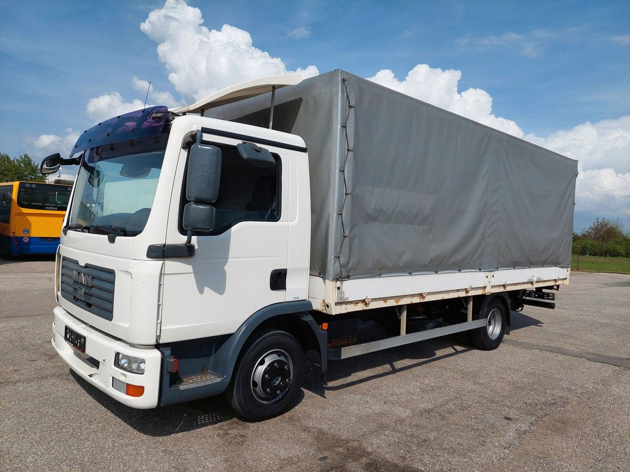 MAN TGL 8.180 4X2 BL - Kravas automašīna ar tentu: foto 1 MAN TGL 8.180 4X2 BL - Kravas automašīna ar tentu: foto 1
