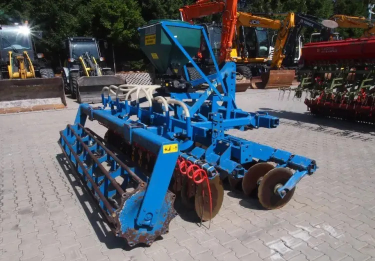 Agregat uprawowo-siewny Rabe Werk 2011 3m brona talerzowa z siewnikiem do poplonów - Kombinētā sējmašīna: foto 5 Agregat uprawowo-siewny Rabe Werk 2011 3m brona talerzowa z siewnikiem do poplonów - Kombinētā sējmašīna: foto 5