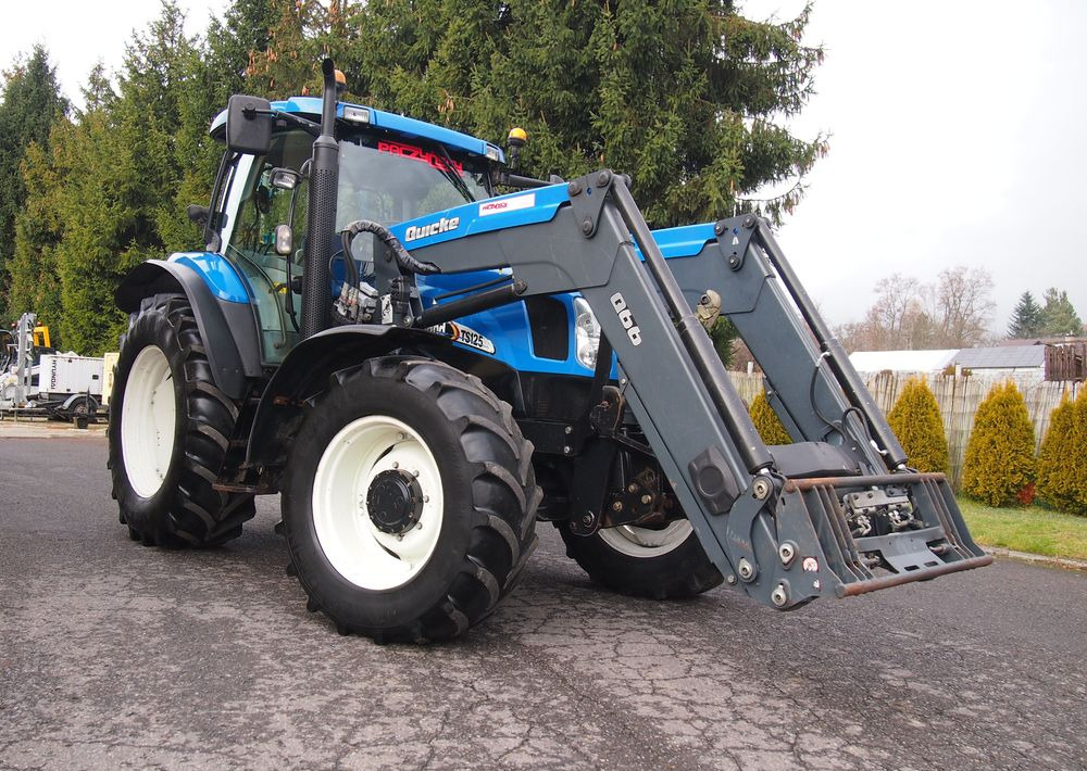 Ciągnik New Holland NH TS125A 6 cylindrów 2004 Ciągnik rolniczy New Holland TS125A - Traktors: foto 2 Ciągnik New Holland NH TS125A 6 cylindrów 2004 Ciągnik rolniczy New Holland TS125A - Traktors: foto 2
