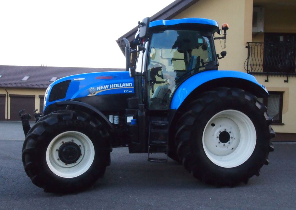 Ciągnik New Holland T7.185 2013 New Holland Autocommand i TUZ - Traktors: foto 2 Ciągnik New Holland T7.185 2013 New Holland Autocommand i TUZ - Traktors: foto 2