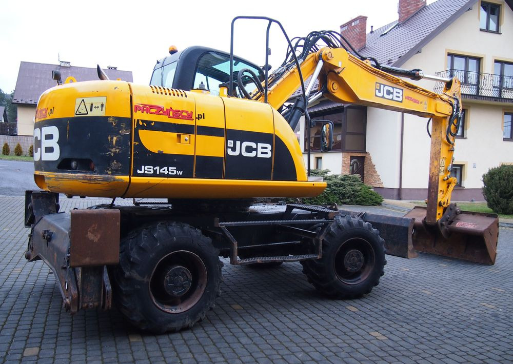 Koparka kołowa JCB JS145W 2011 Koparka JCB - Riteņu ekskavators: foto 2 Koparka kołowa JCB JS145W 2011 Koparka JCB - Riteņu ekskavators: foto 2